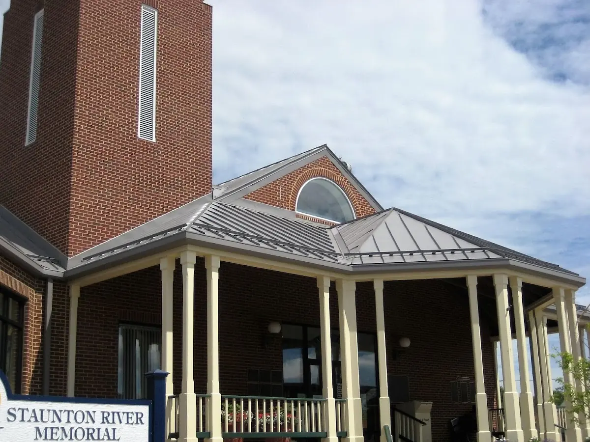 Skilled roofing craftsmen working on a residential roof in Cherry Valley
